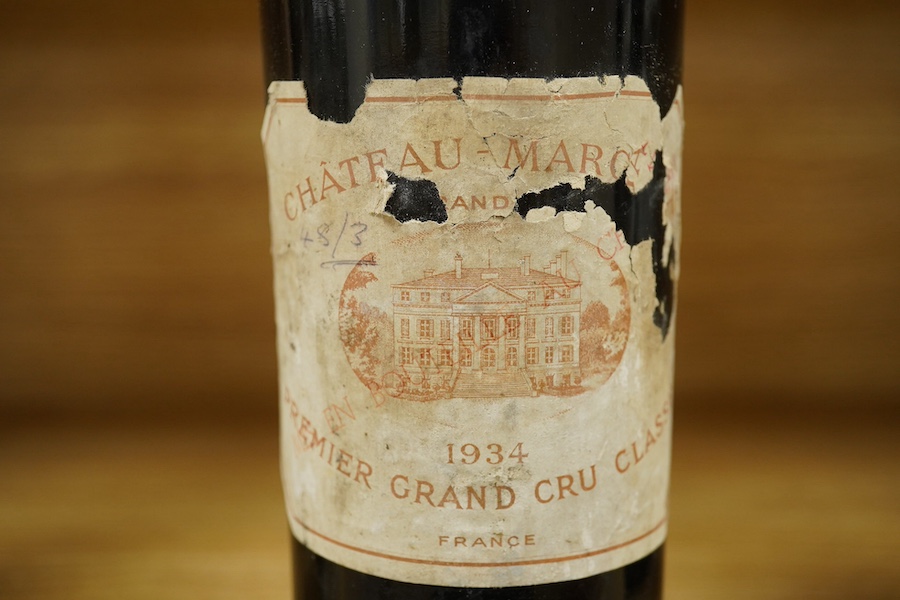 A bottle of Chateau Margaux 1934 Premier Grand Cru, Bordeaux, red wine. Condition - poor, level low and labels damaged, storage history unknown.